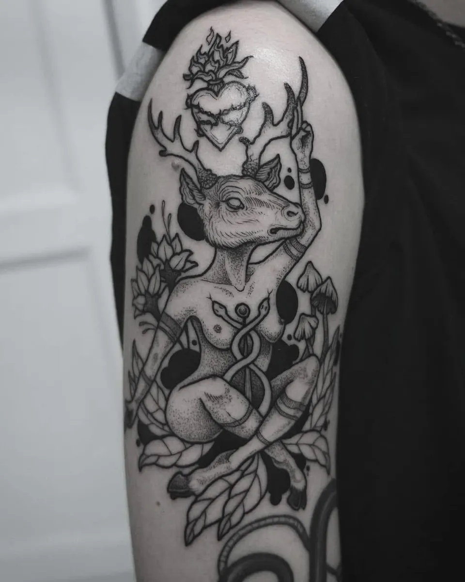 Deer-headed figure with a sacred heart and mushrooms on the upper arm