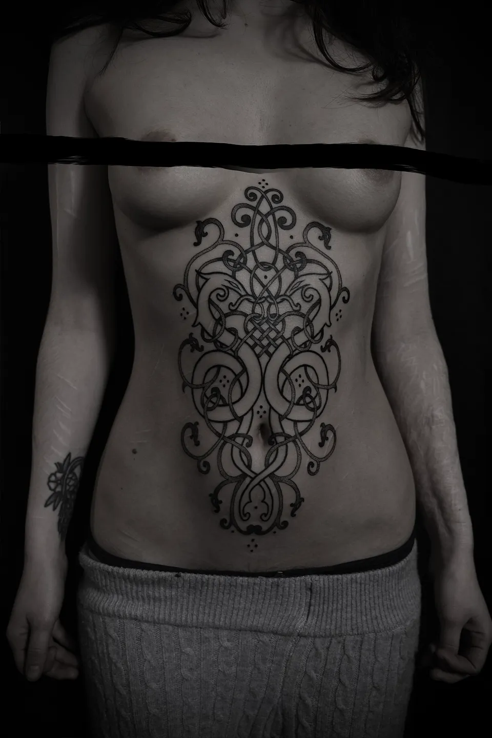 Knotwork ornament down the stomach, front view
