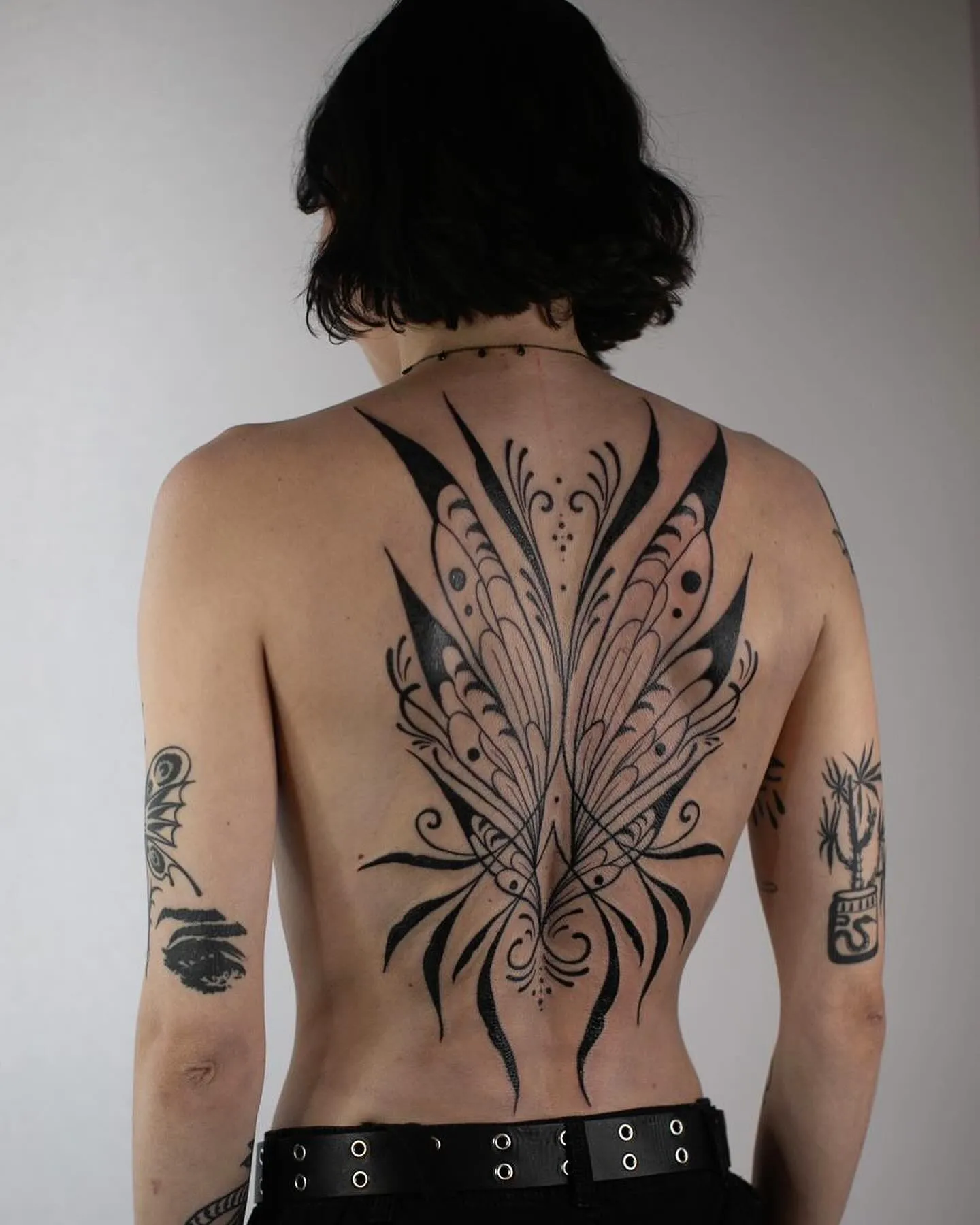Butterfly-wing ornament covering the back