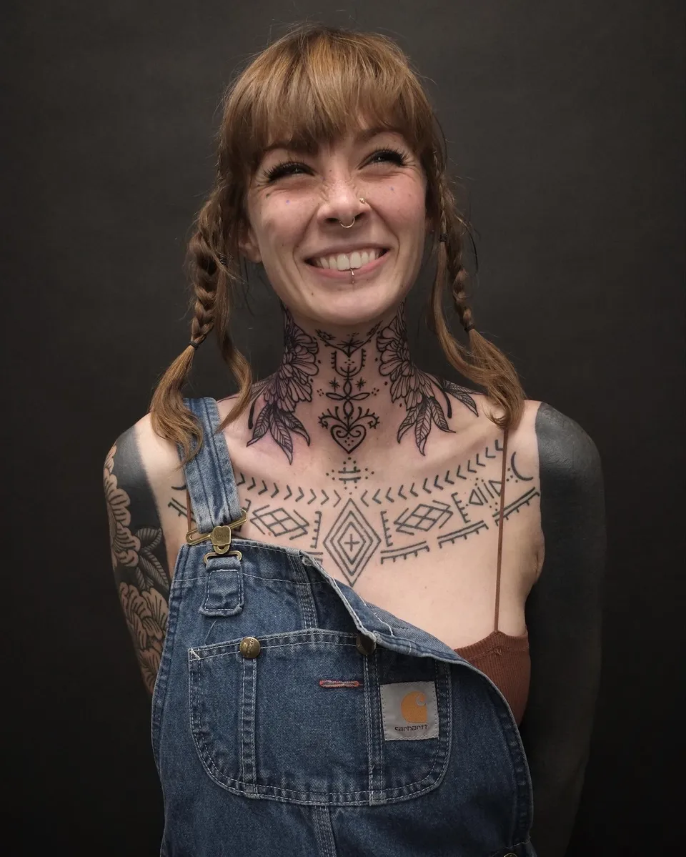 Floral and geometric ornaments across the neck and chest
